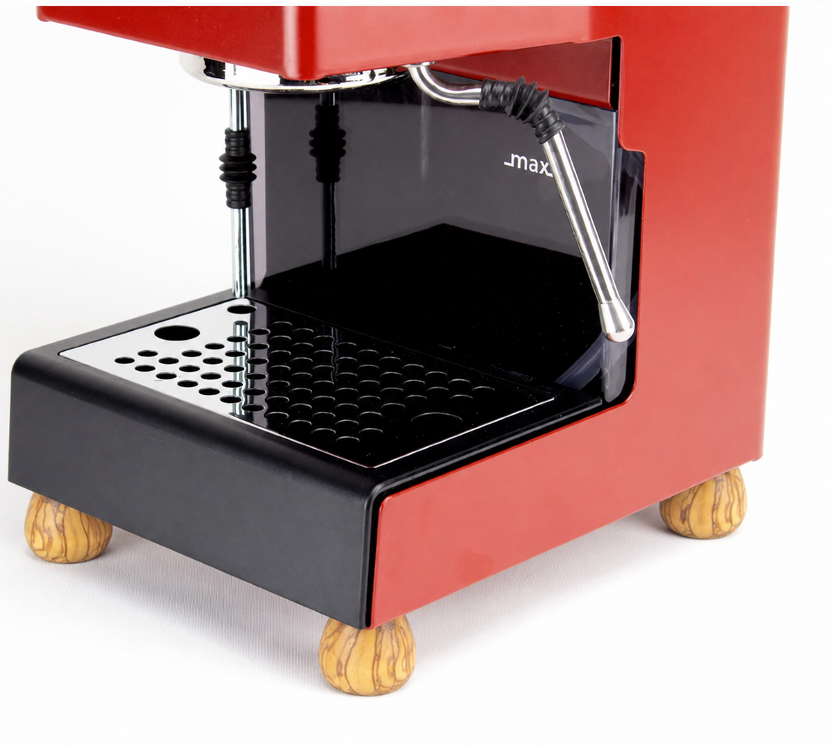 A close-up of a red and black espresso machine with light wood legs, featuring a metal drip tray and a chrome steam wand.