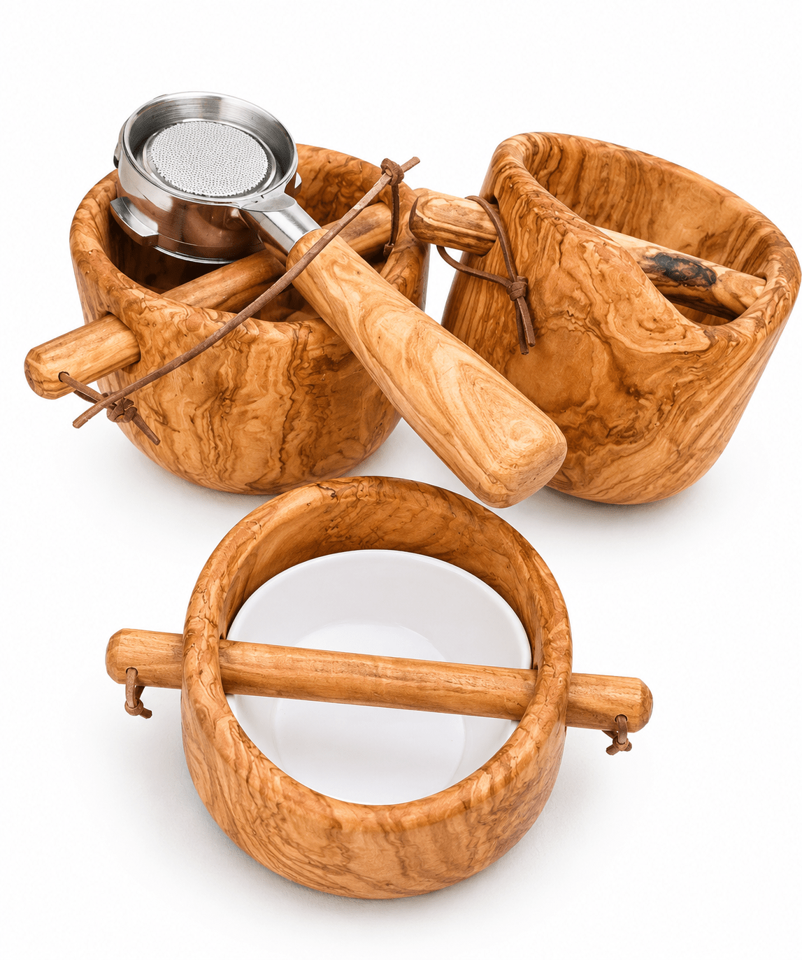 Handcrafted olive wood coffee accessory set with ceramic bowl and stainless steel portafilter on white background
