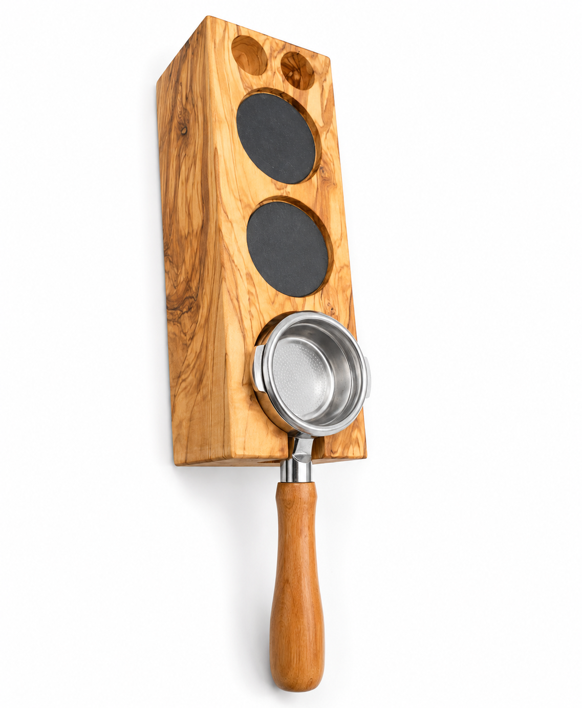 An olive wood coffee bar tool set featuring a rectangular block with three circular black inserts and a stainless steel portafilter with a wooden handle, shown on a white background.